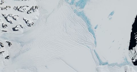 High-altitude overflight aerial of the Scar Inlet Ice Shelf and Larsen embayment, Antarctica. Clip loops and is reversible. Elements of this image furnished by NASA