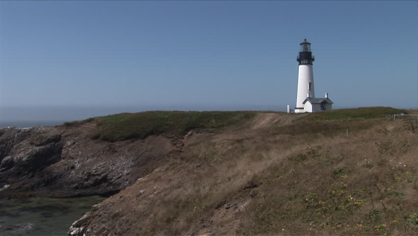 View of Yaquina Lighthouse protecting the coastline in Oregon Coast Pacific Northwest United States