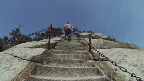 Views of walking to the South Peak of Mount Huashan up the deadly stone stairs near to the plank walk in the sky, in China`s Mt Huashan`s highest peaks, Shanxi province, central China