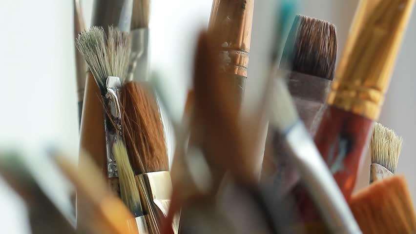 Art studio paint brushes and ink paintings Royalty-Free Stock Footage #24110659