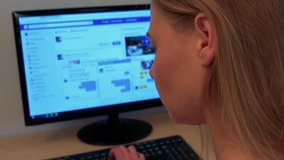 A woamn sits at a desk and types on a computer - Powered by Shutterstock - Get 15% off with code: PIKWIZARD15