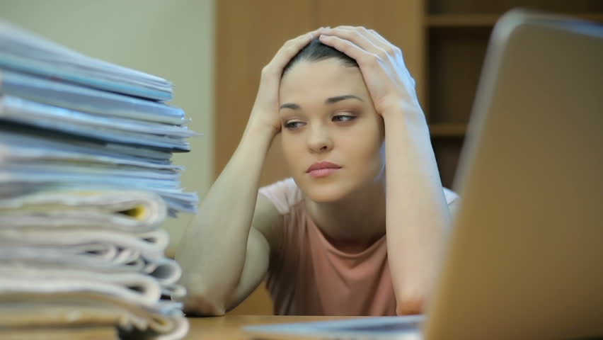 Overwhelmed office worker | Shutterstock HD Video #24115075