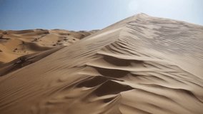 the wind blows through the dunes of the Sahara desert. - Powered by Shutterstock - Get 15% off with code: PIKWIZARD15