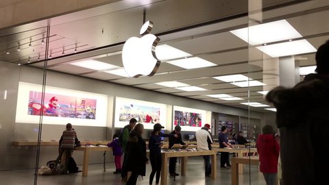 Burnaby, BC, Canada - February 07, 2017 : Motion of people playing iphone inside Apple store with 4k resolution.