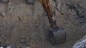 Close-up View of Working Excavator on Construction Site. Full HD 1920x1080 Video Clip