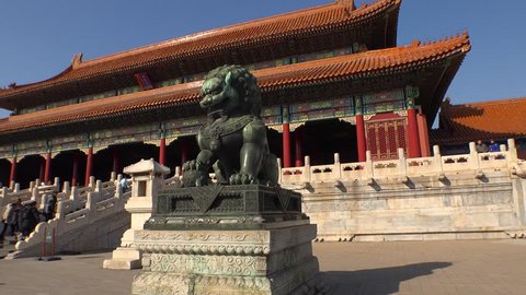 Epic green Chinese Imperial guardian lions. Ming dynasty. Forbidden city Beijing capital of China. Emperor palace. Old Asian culture. Beautiful summer day, Blue sky. Cinematic 4K.