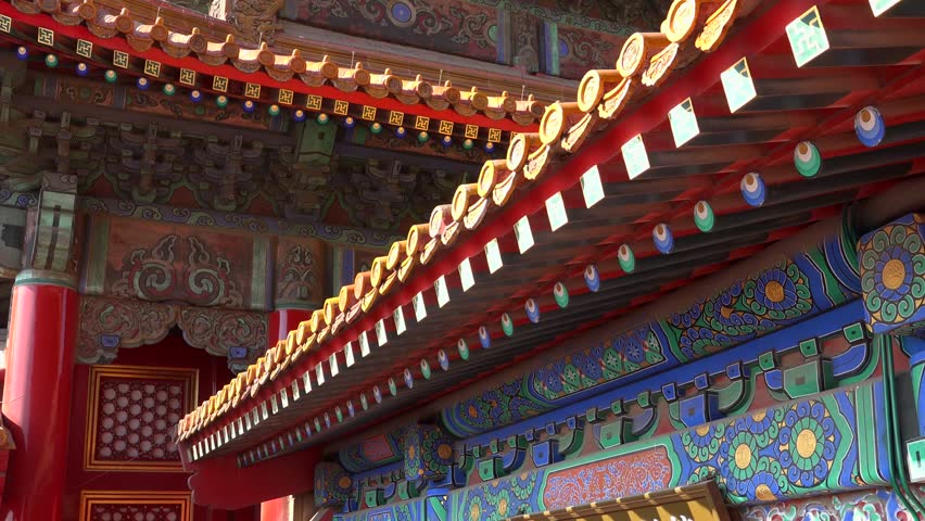 Emperor palace red roof close details. Forbidden city Beijing capital of China. Emperor palace. Old Asian culture. Beautiful summer day, Blue sky. Cinematic 4K.