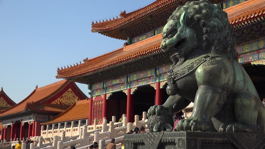 Epic green Chinese Imperial guardian lions. Forbidden city Beijing capital of China. Emperor palace. Old Asian culture. Beautiful summer day, Blue sky. Cinematic 4K.