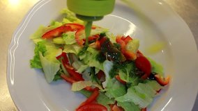 poured salad dressing. Delicious salad with honey sauce. 