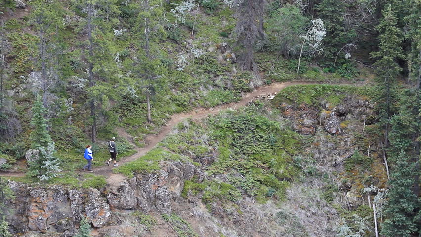 Hikers on famous Yukon River loop trail recreation area of Schwatka Lake.