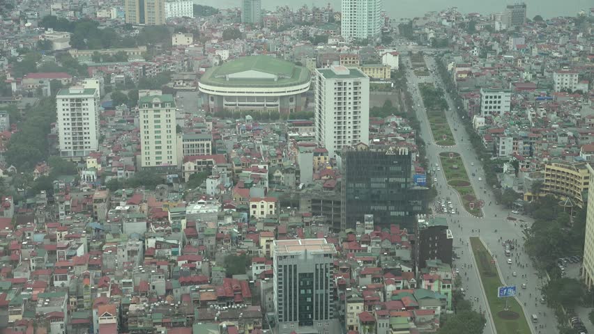 Hanoi with view from above, with people and crowed traffic on the way.