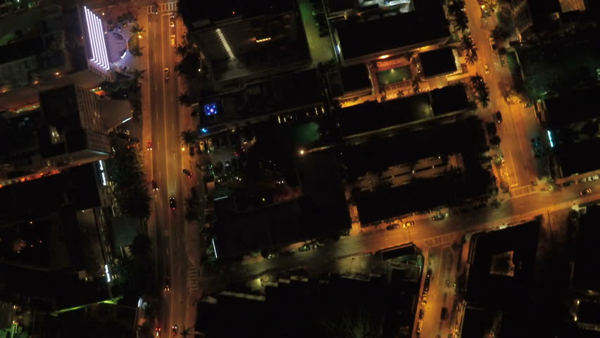 Miami Aerial v40 Flying low over Miami Beach looking down vertically at night.