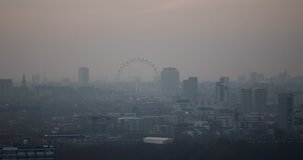 London - Aerial Shot Of The London Eye Rising Above The London Skyline