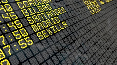 Close-up of an airport departure board to Spanish cities destinations, with environment reflection.Part of a series. 4k video resolution (4096x2304).
