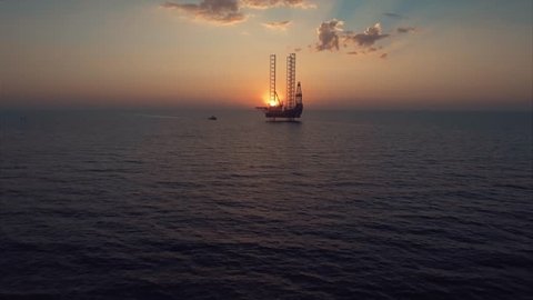 Flying to the oil platform above the ocean 