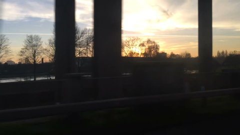 Dynamic Moving Shot , inside a car, as concrete motorway and bridge pass by