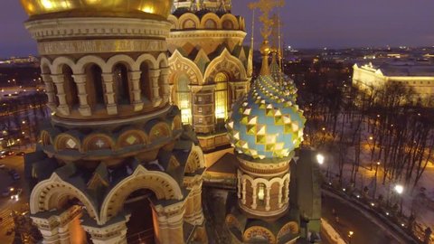 Church of the Savior on Spilled Blood Tserkov Spasa na Krovi main sights of St. Petersburg, Russia. Colorful domes. Mosaic interiors. Night, city illumination, lights. 4k drone footage. Panorama.