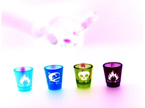 Alcohol into shot glasses with effects.