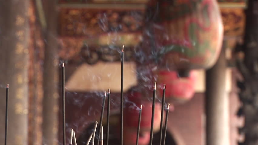 Close-up of incense slowly burning down in Bao-an Temple Taipei Taiwan