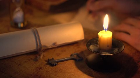 writing letter in candlelight
