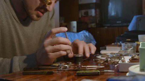 watchmaker clockwork repairs in the workshop