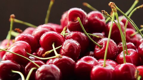 Fresh, ripe, juicy cherries rotate clockwise