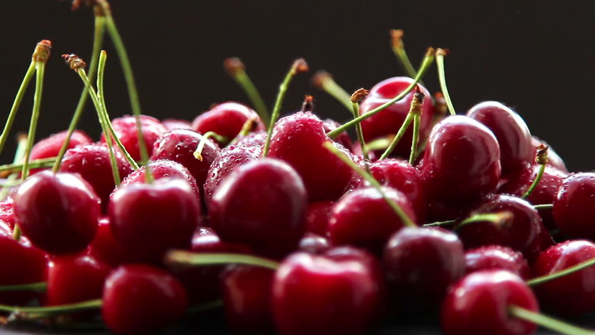 Fresh, ripe, juicy cherries rotate clockwise