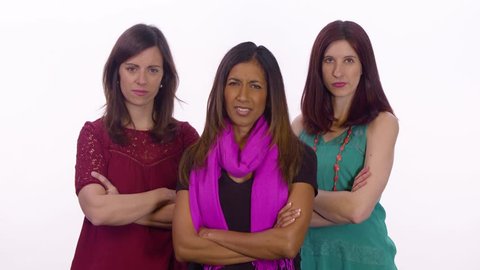 Three female bullies point and laugh. Medium shot on white background.