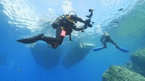 underwater photographers ascending underwater