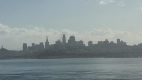Zooming timelapse of misty San fransisco cityscape, on a warm, sunny november day, in California, United states of america.