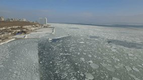 Drone flies high over the frozen Black Sea in Odessa, February 2017
