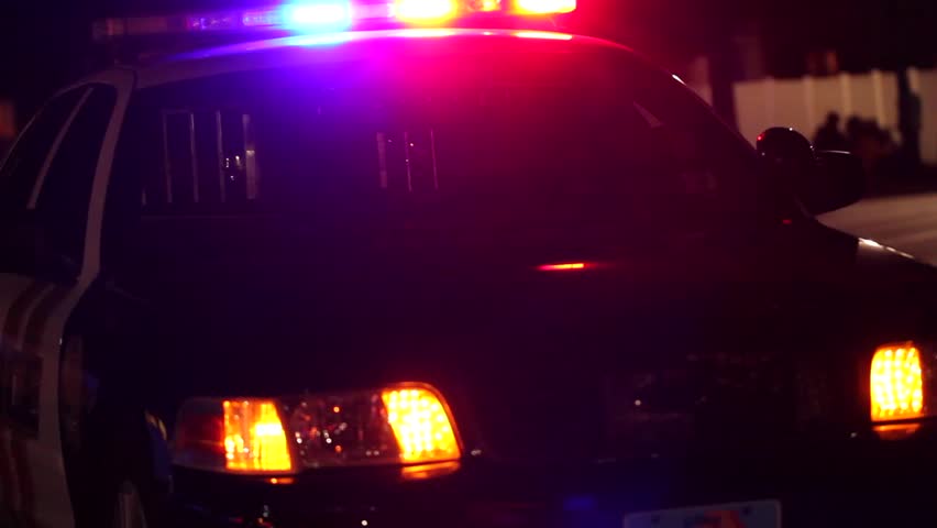 Police lights flashing at night
