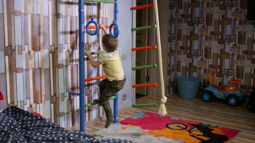 Twin kids boys have fun enjoy playing fighting with boxing gloves at home - little beginners boxers