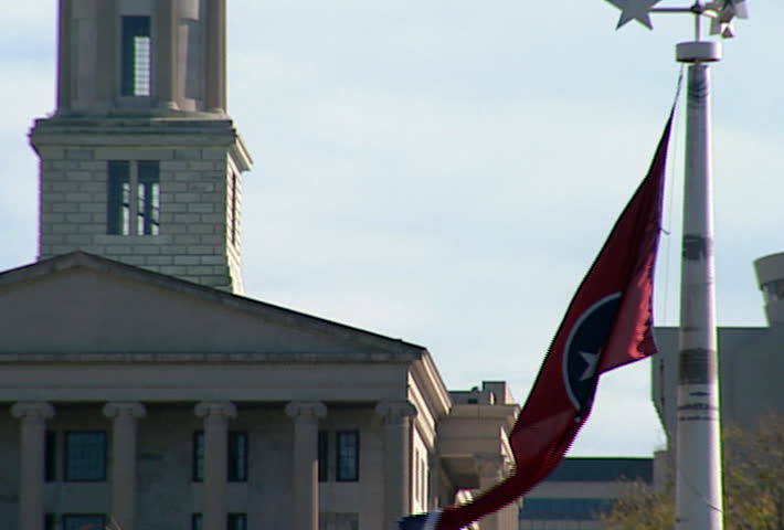 NASHVILLE - Circa 2002: Facade of Tennessee State Capitol with the Tennessee Flag in Nashville in 2002.