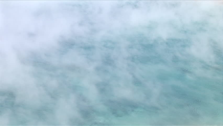Closeup of natural spring  spewing steam in Yellowstone National Park Wyoming United States
