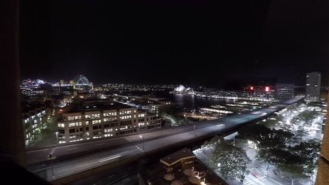 Sydney harbor night timelapse view of opera house, sydney harbor bridge, ferry and cruise ship terminal