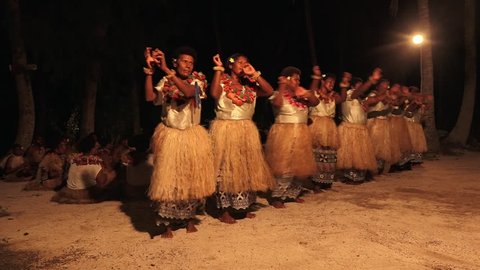 Indigenous Fijian women dancing the traditional Meke female dance, the fan dance. Real people. Copy space