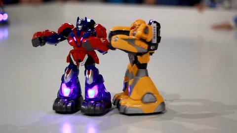 Robot transformer fighting. Closeup of transformer robot fighting. Toy robots boxing. Multicolored plastic toy robot fighting. Close up of battle robot toys