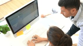 Startup business partners working together in desktop
