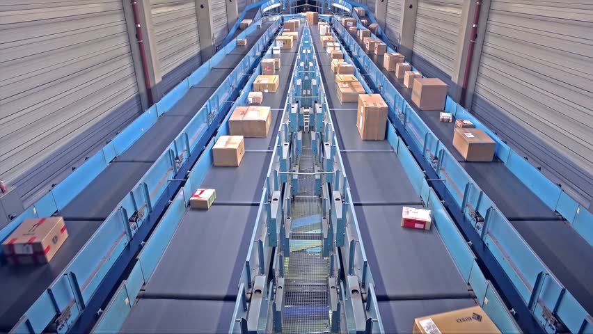 Parcels on conveyors - long version Royalty-Free Stock Footage #24259616