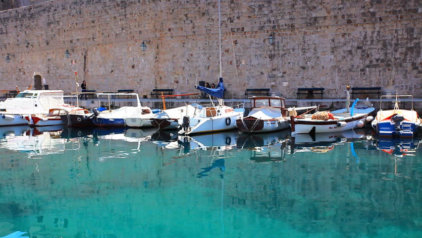 Dubrovnik old town harbor with boats