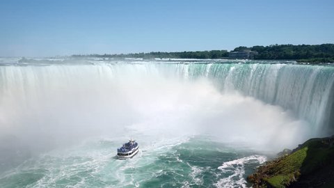 Niagara Falls, tourist boat in front of Horseshoe waterfall on the border of US and Canada.