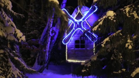 Mill Cottage illuminated at night. Overall plan. Winter snow