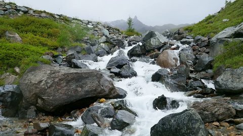 Beautiful small mountain waterfall in the Austrian alps near the Grossglockner