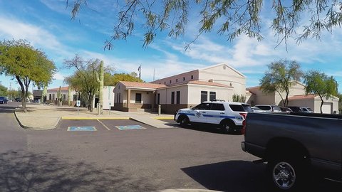 APACHE JUNCTION AZ/USA: February 16, 2017- Highway Patrol SUV at Pinal County government complex building. Officer and vehicle is seen leaving station for duty in the field.
