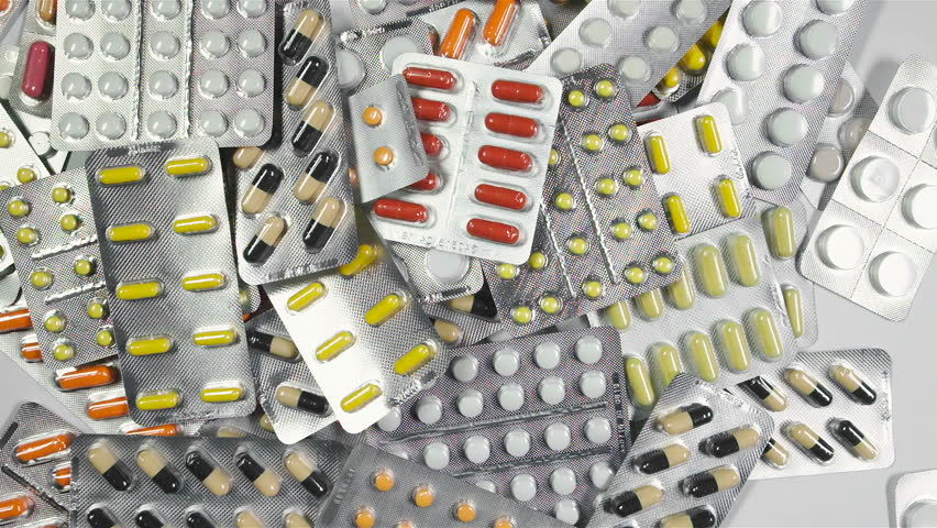 Closeup shot of falling pills. Healthcare industry concept. Pharmaceutical, medical capsules falling on table. Drug components, medical product pellet capsules. Piling up pills of different vitamins. Royalty-Free Stock Footage #24291476