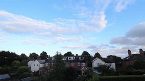 Day To Night Clouds Timelapse Light Fades in coloured Sky Above Rooftops