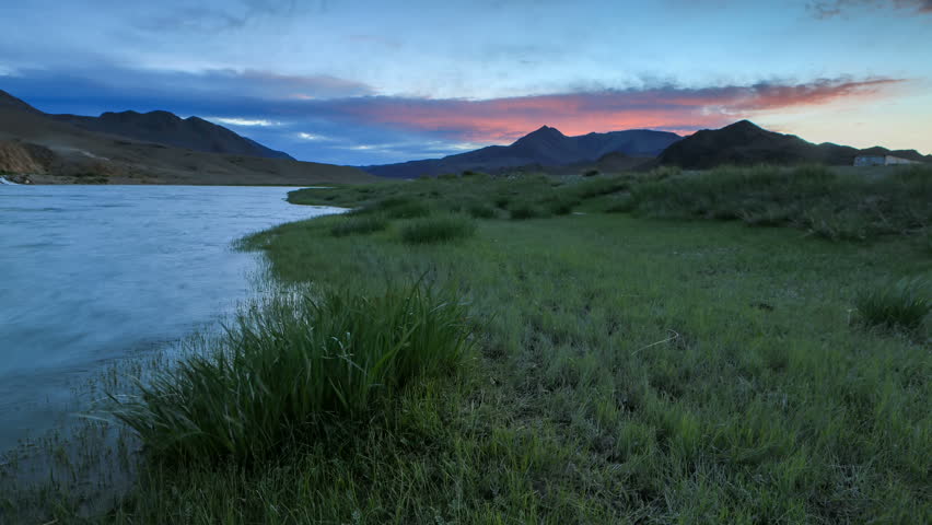 Sunset on the Khovd river, Mongolian Altai, Mongolia. Full HD.