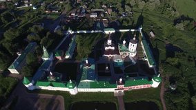 Aerial view drone video of beautiful monastery in sunny afternoon in Dmitrov area of central Russia in summer time