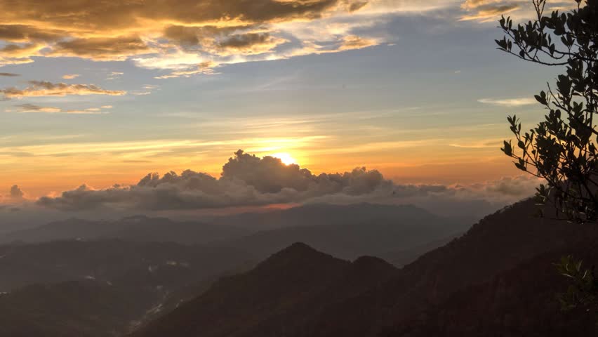 Sunset on mountain with beautiful sunbeam through the cloud in Sabah,  Malaysia